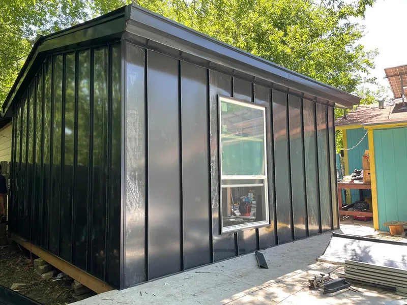 Black standing seam metal wall panels for Metal Roof Installation in Leland