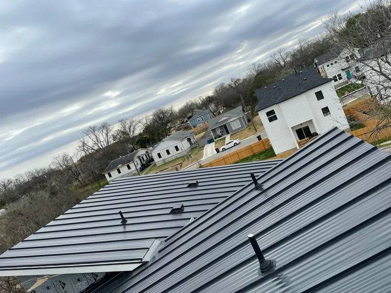 Standing seam metal roof panels with vents for Skylight Repair in Leland